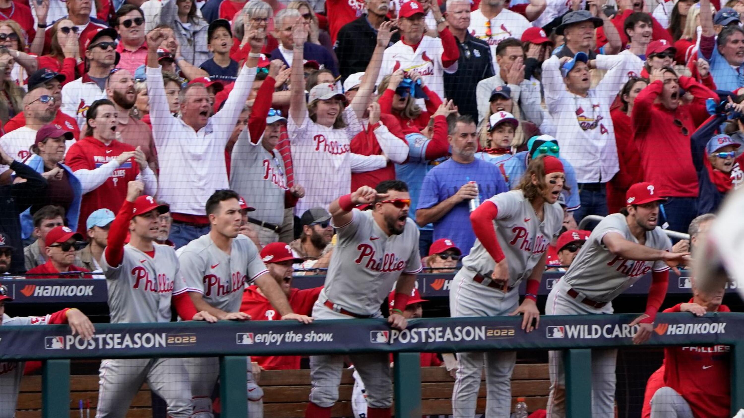 Phillies score 6 in the 9th to down Cardinals in opening game of