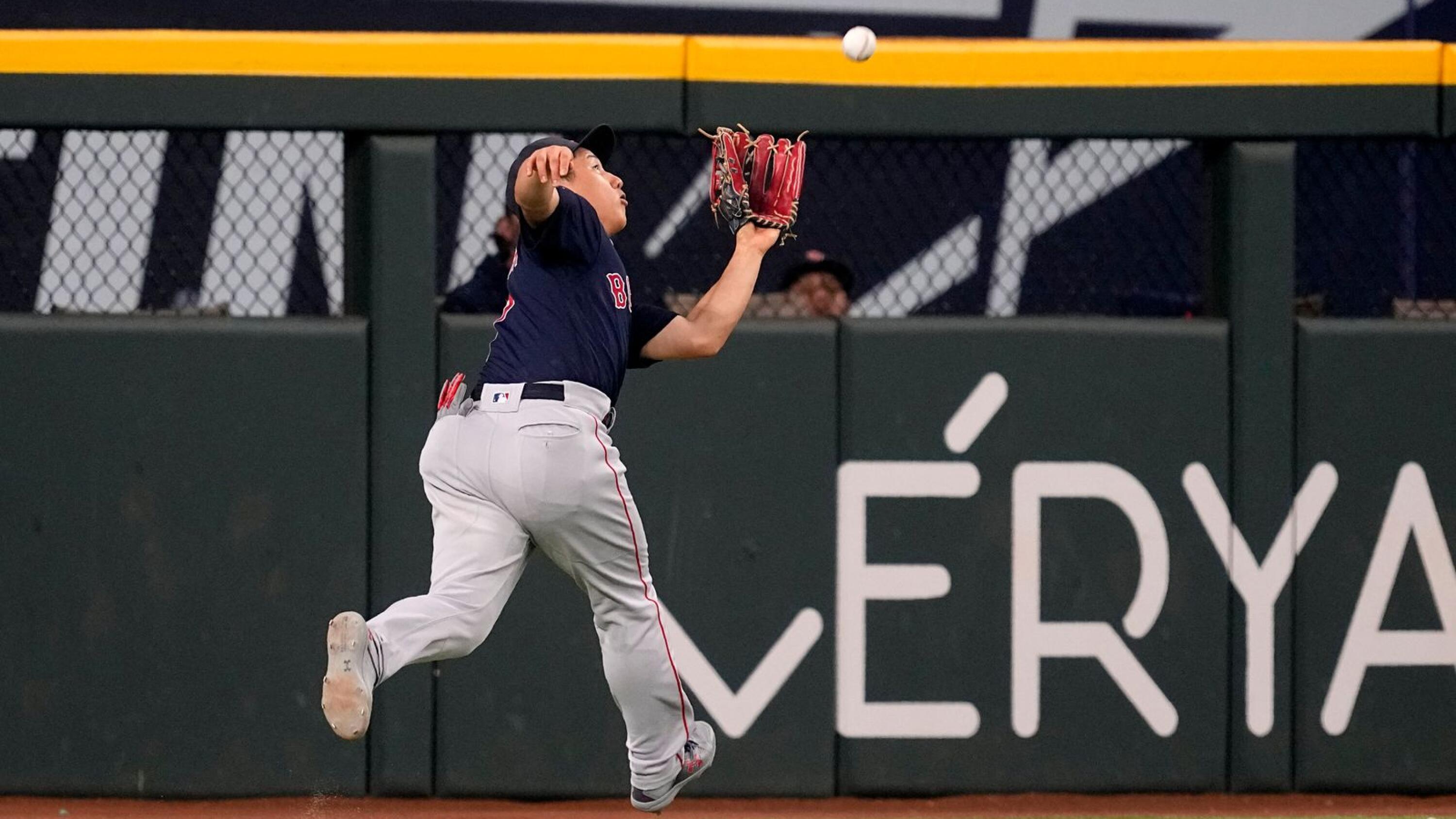 Texas Rangers' Jonah Heim runs the bases after a solo home run in