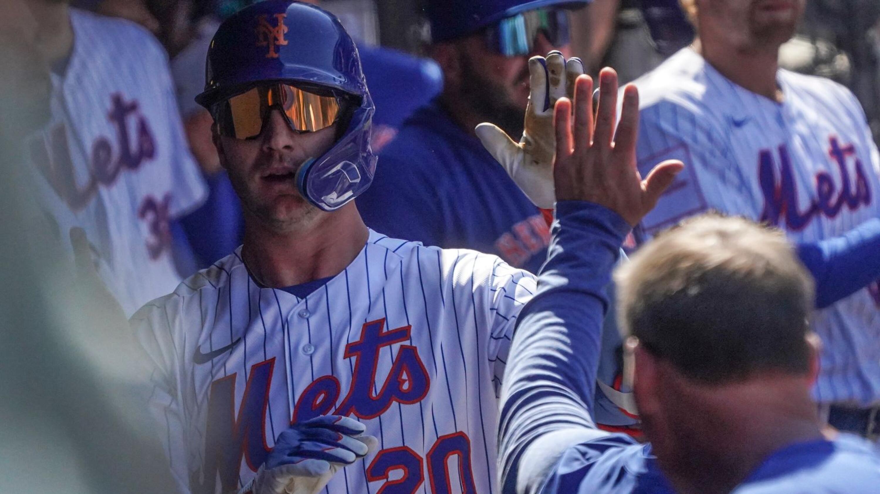 New York Mets' Pete Alonso celebrates in the dugout after hitting