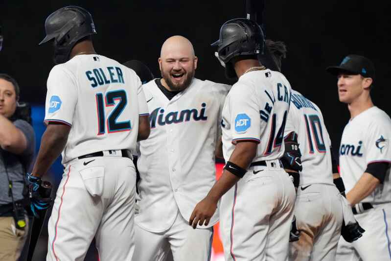 Miami Marlins' Jake Burger celebrates his home run during the