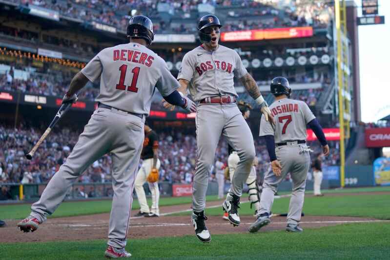 Boston Red Sox center fielder Jarren Duran throws the ball after