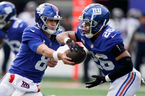 Jones, Barkley lead Giants past Texans 24-16 for 7-2 start