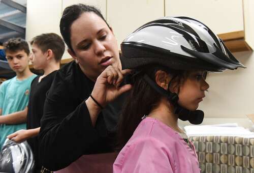 Families receive bike helmets at Backus Hospital’s Safety Camp