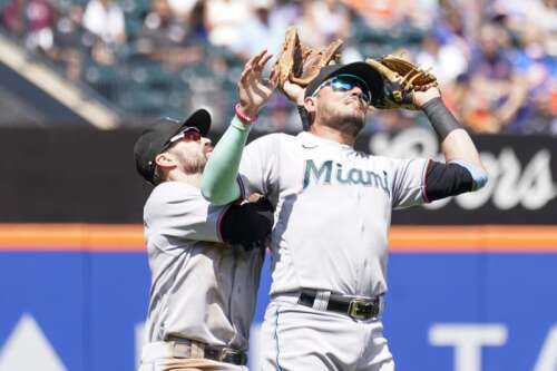 Miami Marlins' Billy Hamilton celebrates after scoring on an RBI single by  Jon Berti in the 10th inning of a baseball game against the New York Mets,  Saturday, July 9, 2022, in