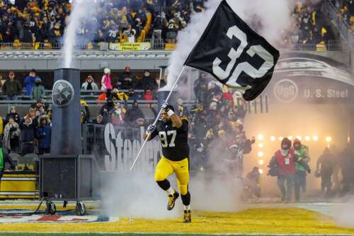 Franco Harris' widow on field in Pittsburgh as his No. 32 retired - WHYY