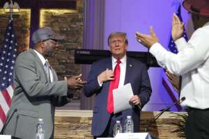 Trump blasts immigrants as he courts voters at a Black church, MAGA event in Detroit