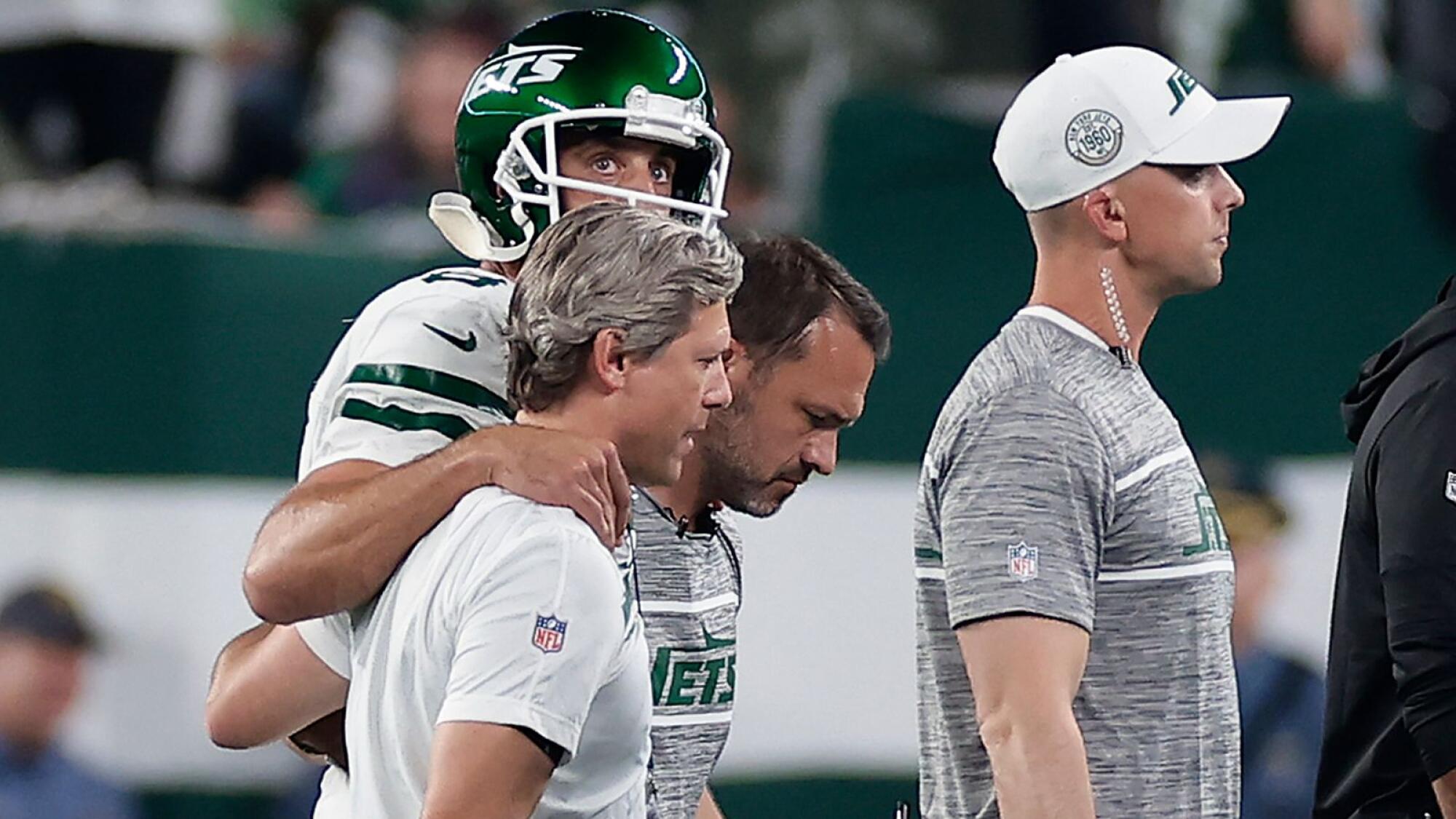 Jets lose Aaron Rodgers to an Achilles tendon injury, then rally to stun  Bills 22-16 in overtime
