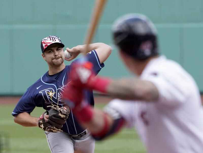 Tampa Bay Rays pitcher Phoenix Sanders, left, throws to first base