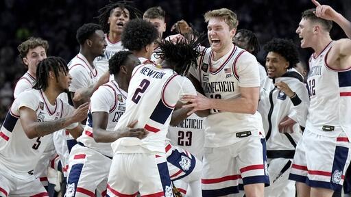 UConn basketball players celebrate their victory over Purdue in NCAA championship game